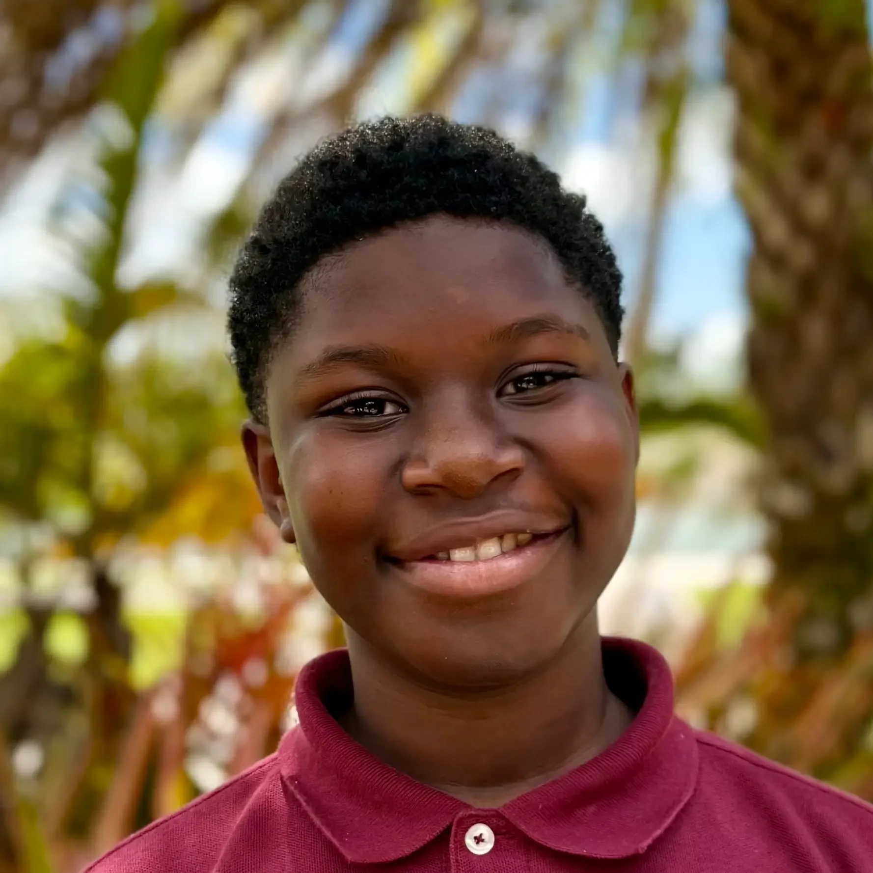 Brandon Fan Student Sawgrass Adventist School - young male student smiling at the camera.