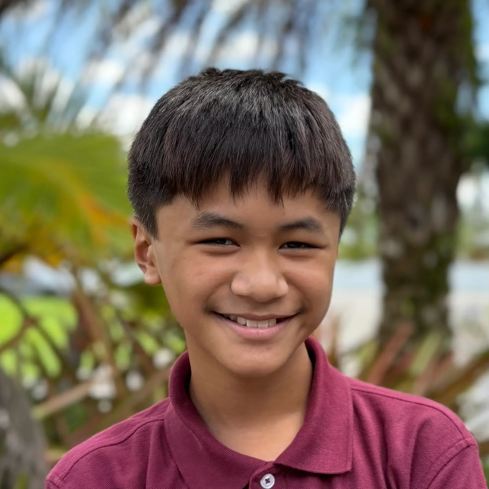 Cin Thang Student Sawgrass Adventist School - young male student smiling at the camera.