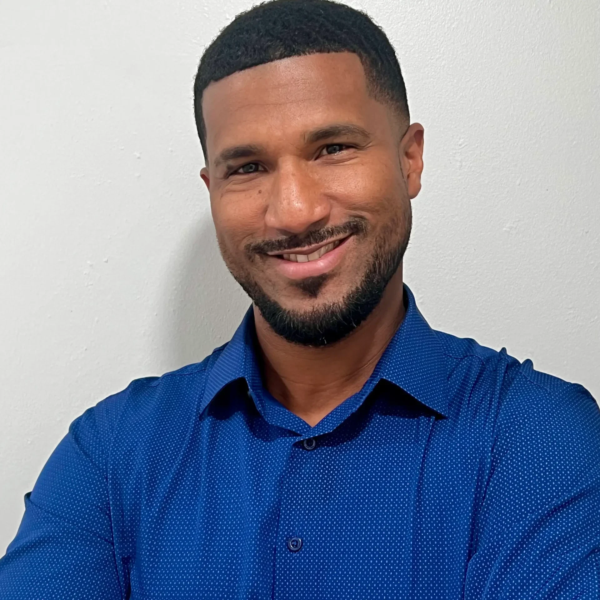 Dane Hurst Teacher Sawgrass Adventist School - male teacher smiling at the camera.