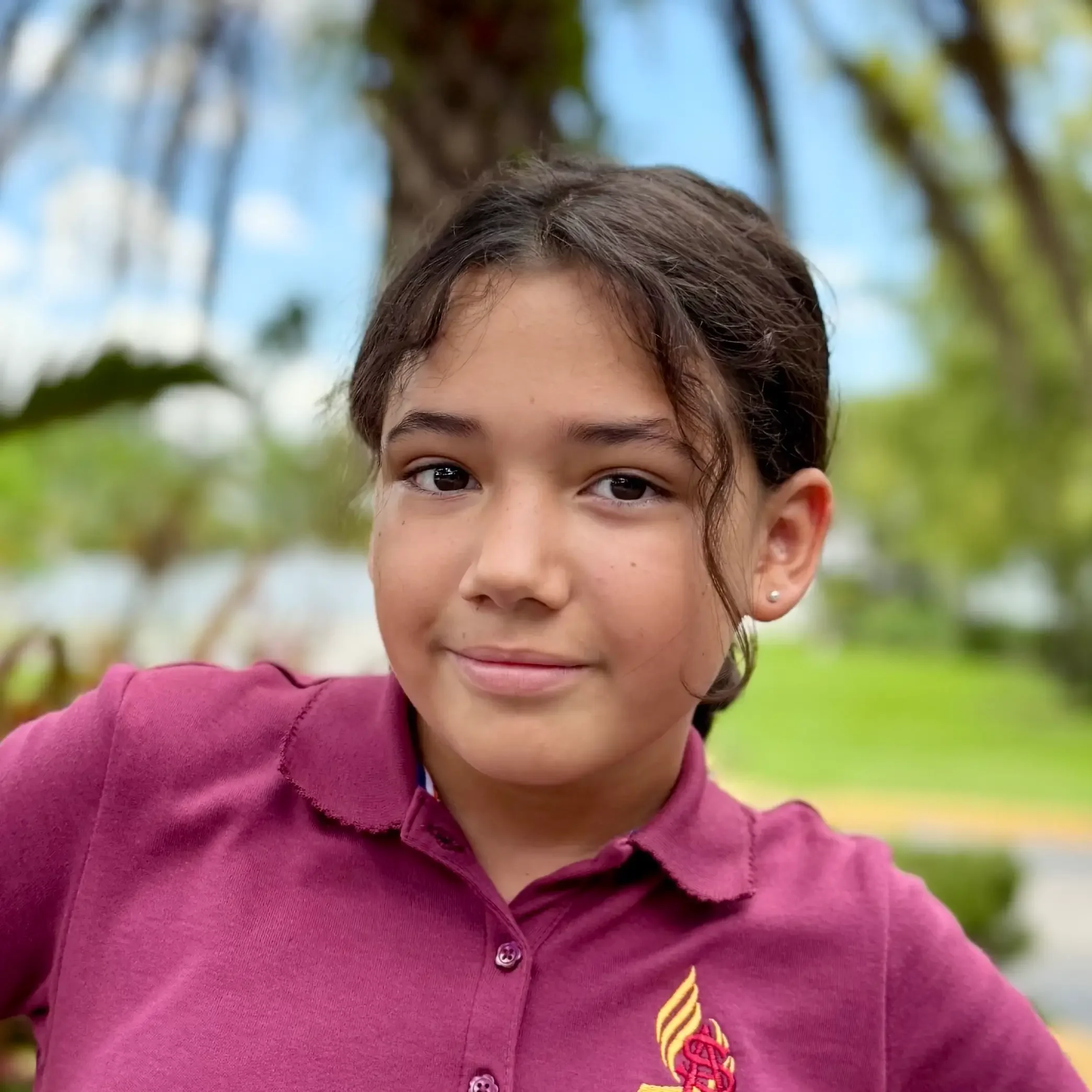 Isabella Ortiz Student Sawgrass Adventist School - young female student smiling at the camera.
