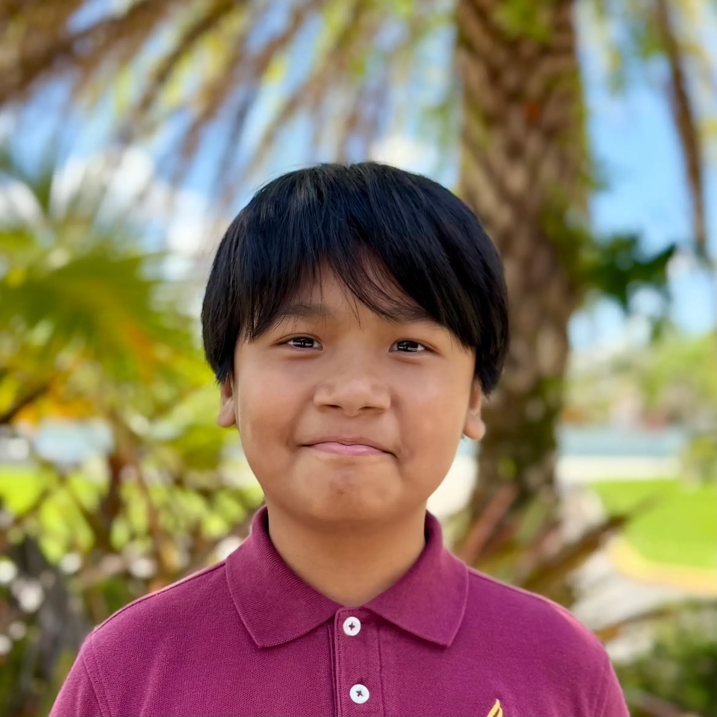 Mung Thang Student Sawgrass Adventist School - young male student smiling at the camera.