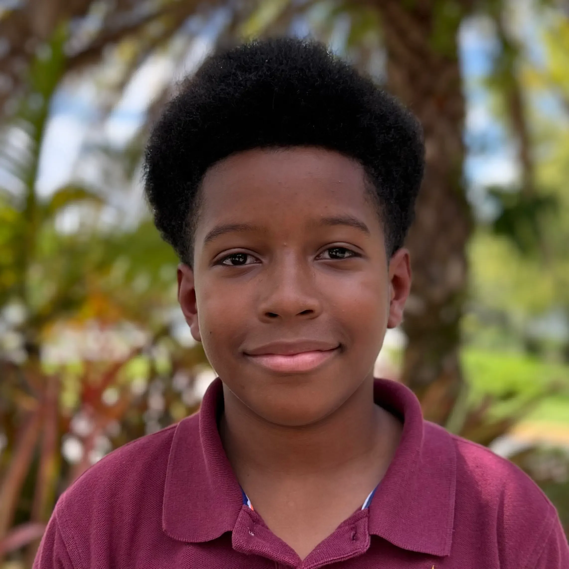 Nathan Knott Student Sawgrass Adventist School - young male student smiling at the camera.